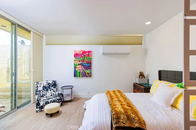 a bedroom with a bed and a couch