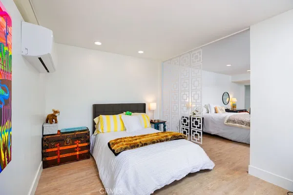 a bedroom with a bed and a couch