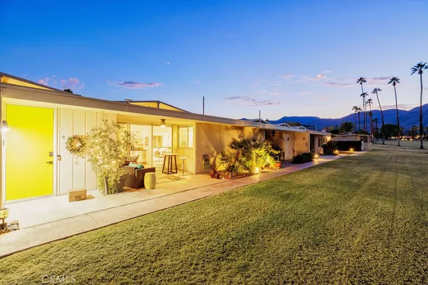 a view of a city street with furniture