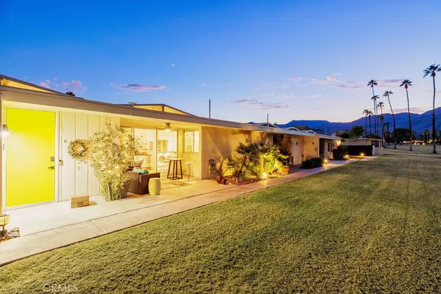 a view of a city street with furniture