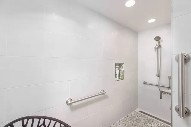 a bedroom with a bed and a table