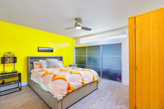 a bed room with a bed and a chandelier