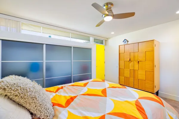 a utility room with a sink a vanity and a mirror