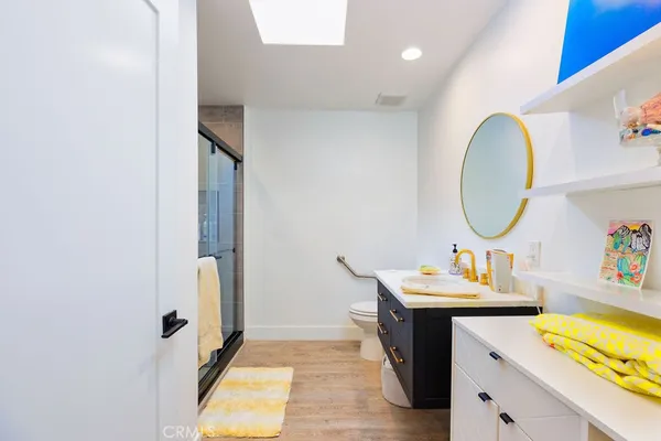 a bathroom with a glass shower door