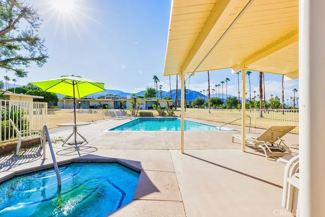 a view of swimming pool with outdoor seating