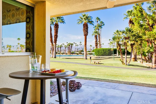 a view of a swimming pool with an outdoor seating