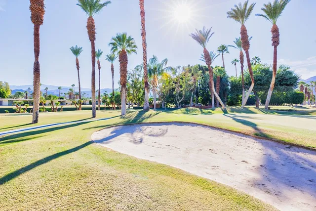 a front view of a house with outdoor seating