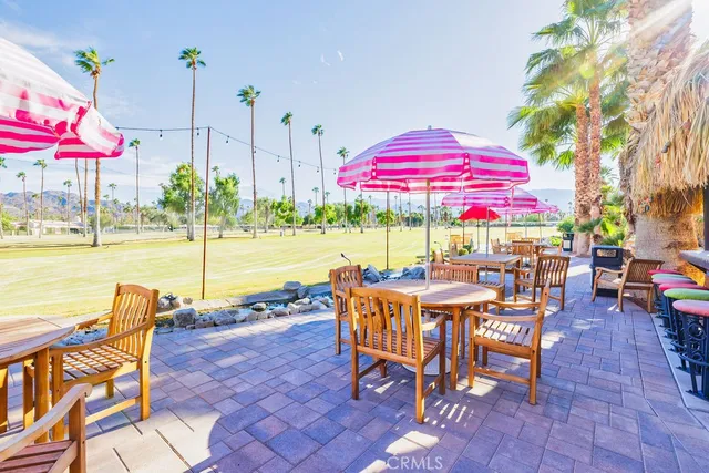 a view of a lake with a table and chairs