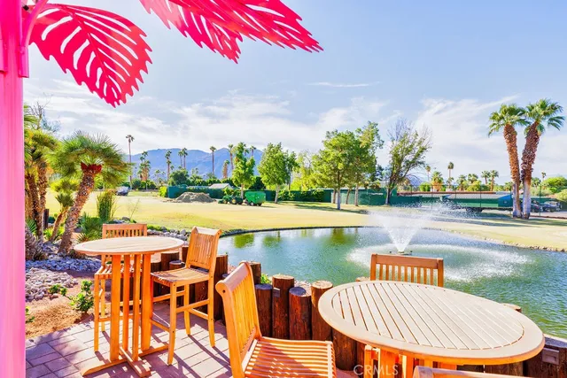 a view of a chairs and table in the patio