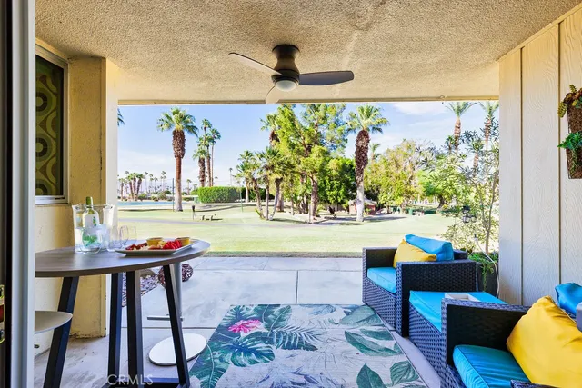 a view of swimming pool with seating area
