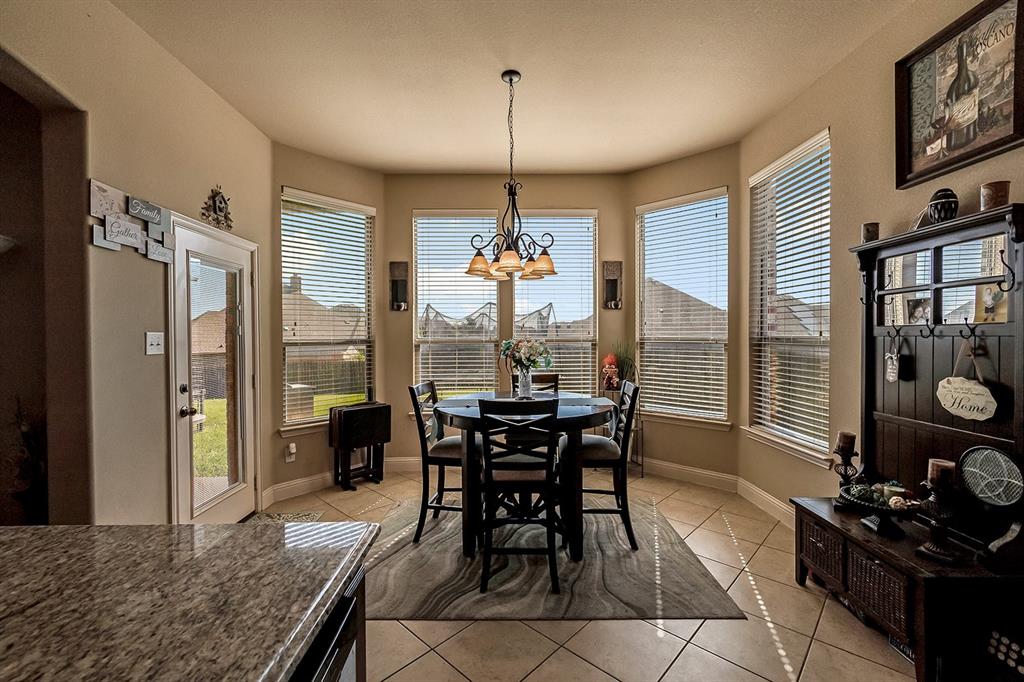 3206 Meadow Ridge Drive Midlothian, TX 76065 - Photo 27 of 37 a dining room with furniture a chandelier and window