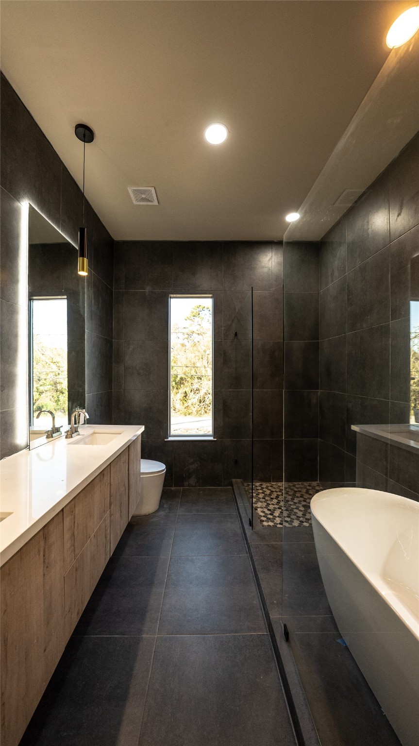 0 Noah Street Houston, TX 77021 - Photo 12 of 15 a bathroom with a large tub and sink