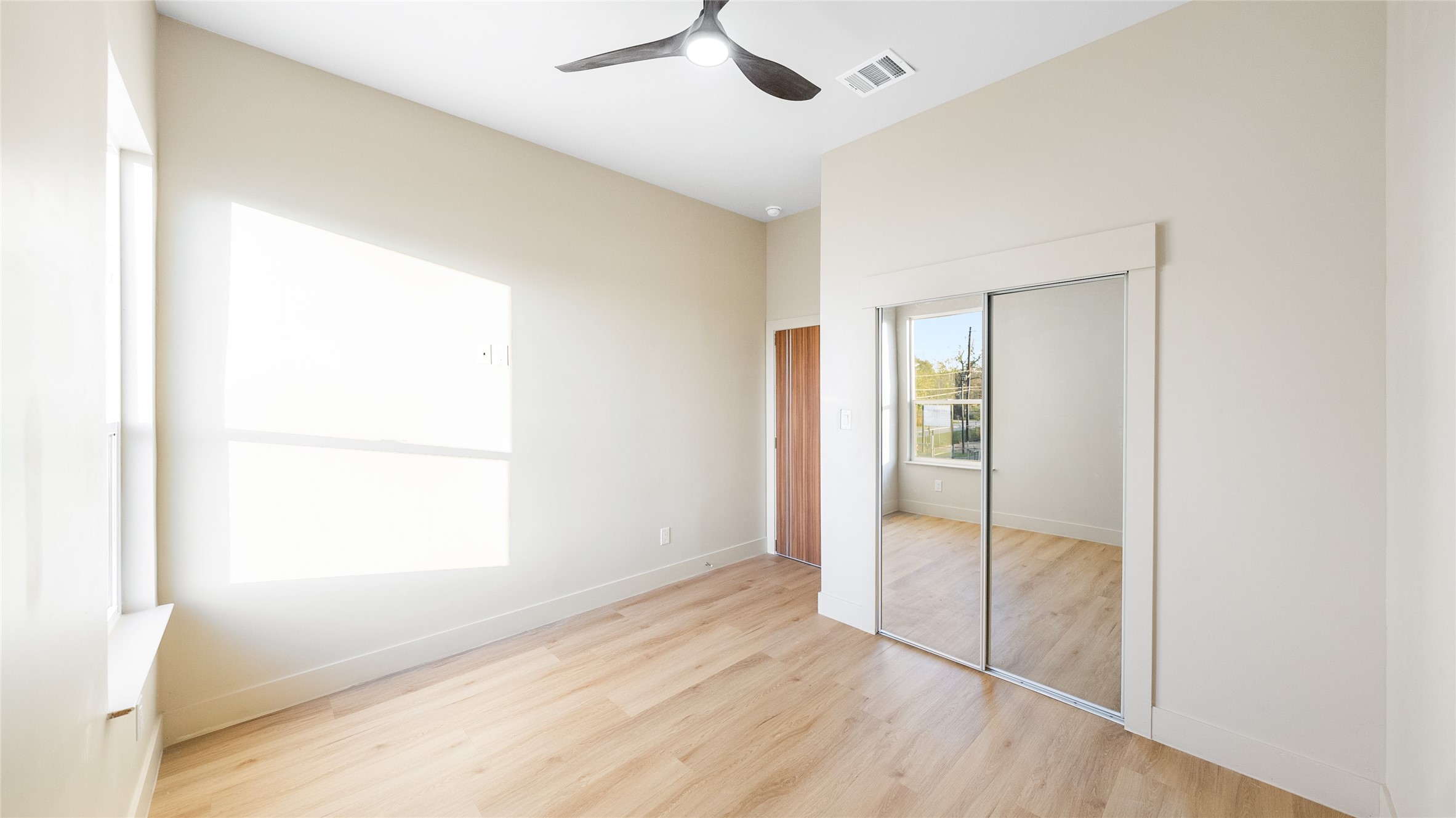 0 Noah Street Houston, TX 77021 - Photo 15 of 15 a view of an empty room with wooden floor and a window