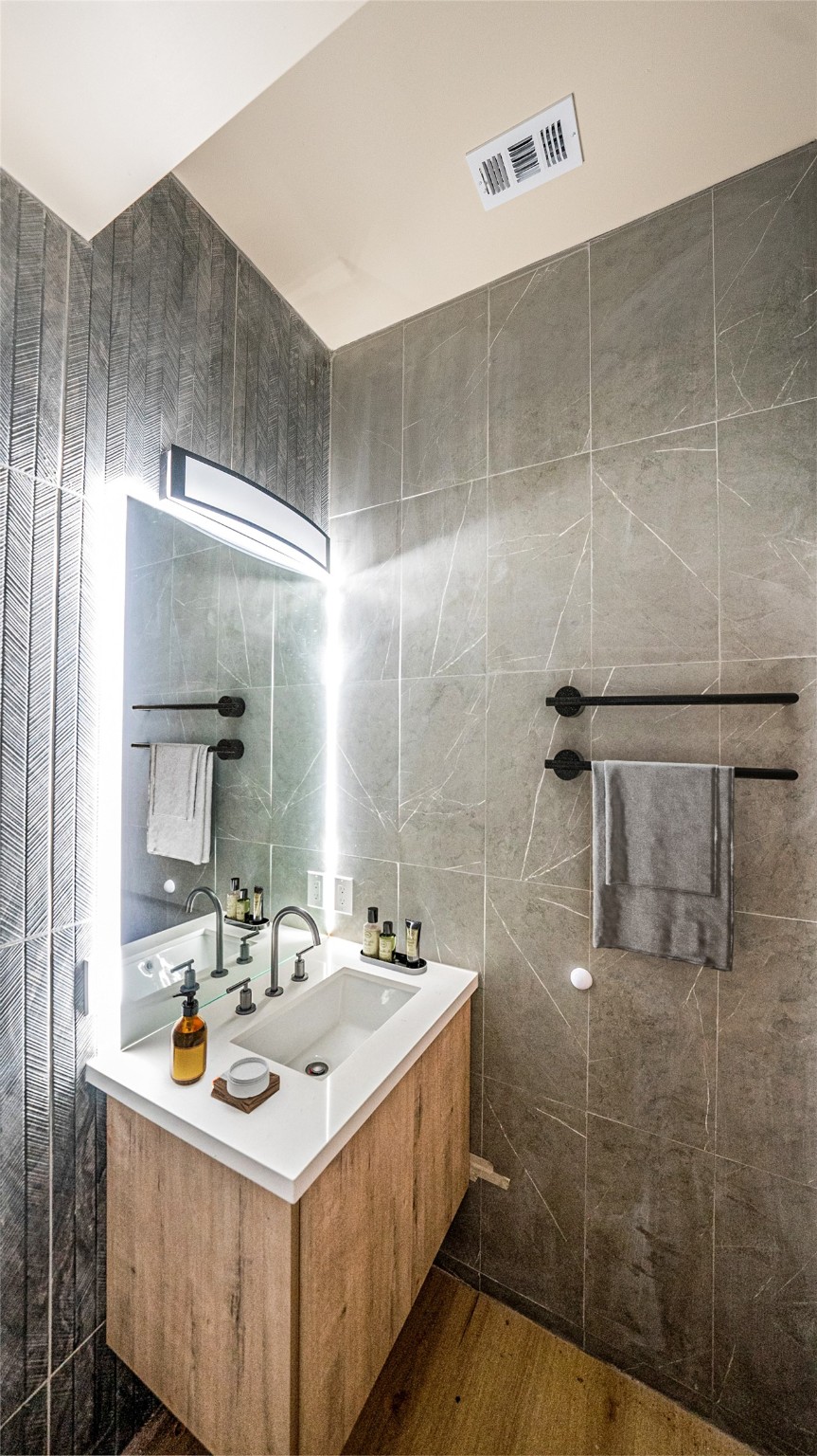 0 Noah Street Houston, TX 77021 - Photo 8 of 15 a bathroom with a sink mirror and shower