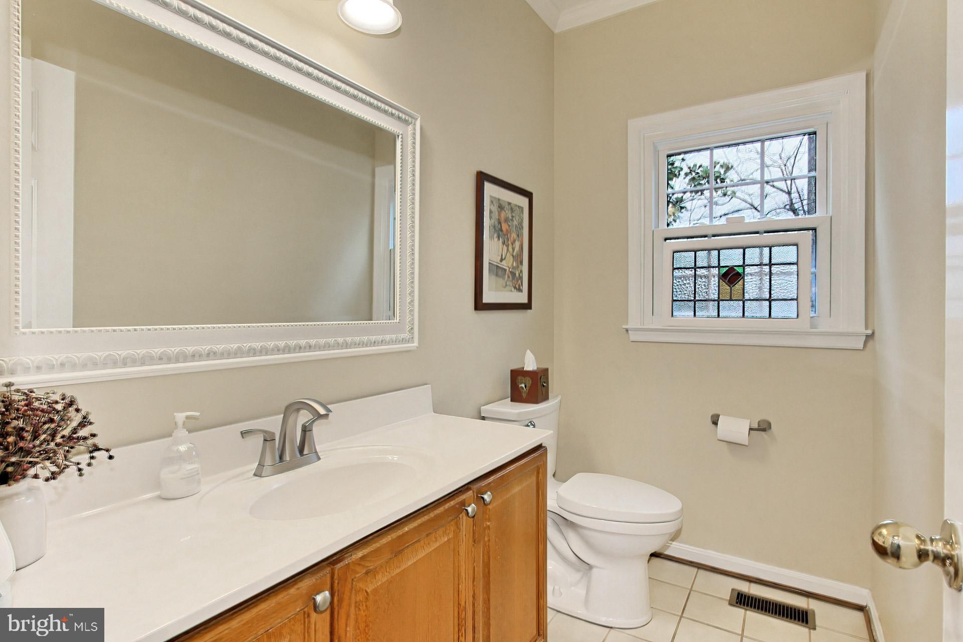 8126 Ridge Creek Way Springfield, VA 22153 - Photo 18 of 50 a bathroom with a granite countertop sink mirror and toilet