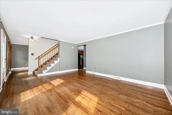 a view of an empty room with a fireplace
