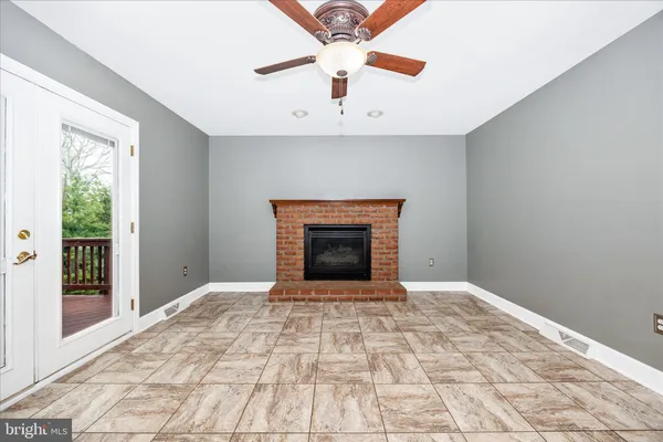 a living room with furniture and white walls