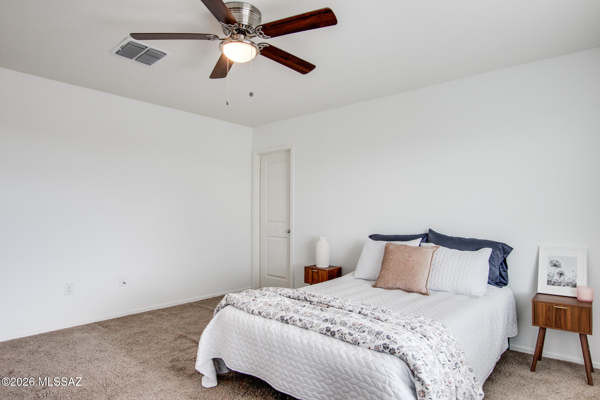 5987 South Antrim Loop Tucson, AZ 85706 - Photo 21 of 34 a bedroom with a bed and a ceiling fan