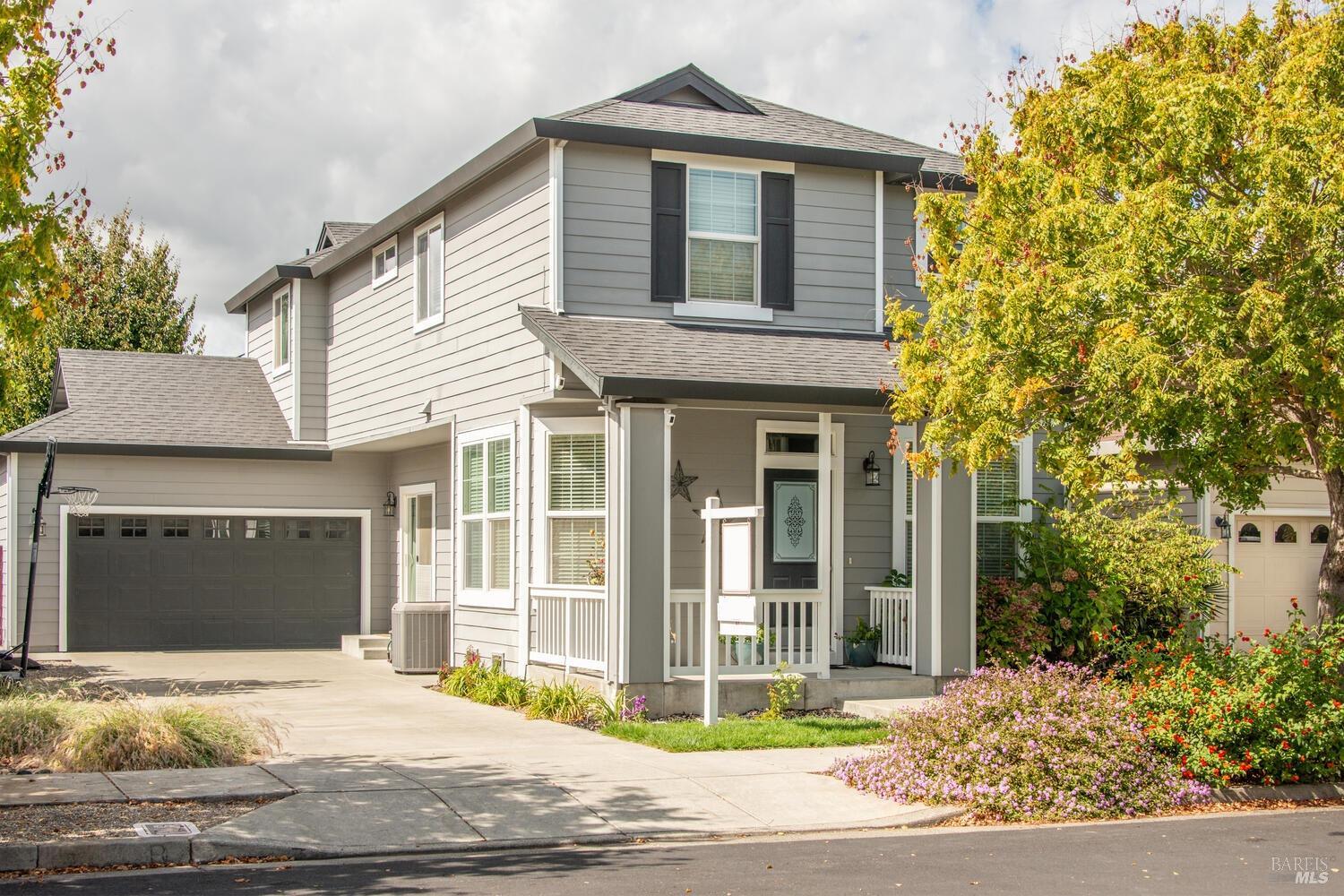 a front view of a house with garden
