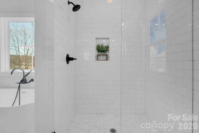 a bathroom with a bathtub and a sink