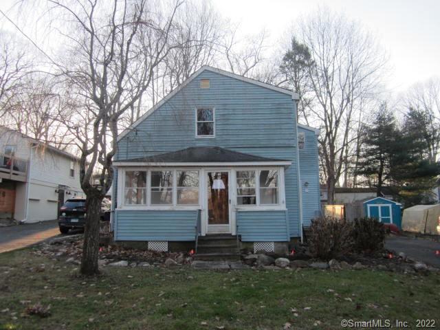 14 Rabbit Trail Coventry, CT 06238 - Photo 1 of 1 a front view of a house with a yard and trees