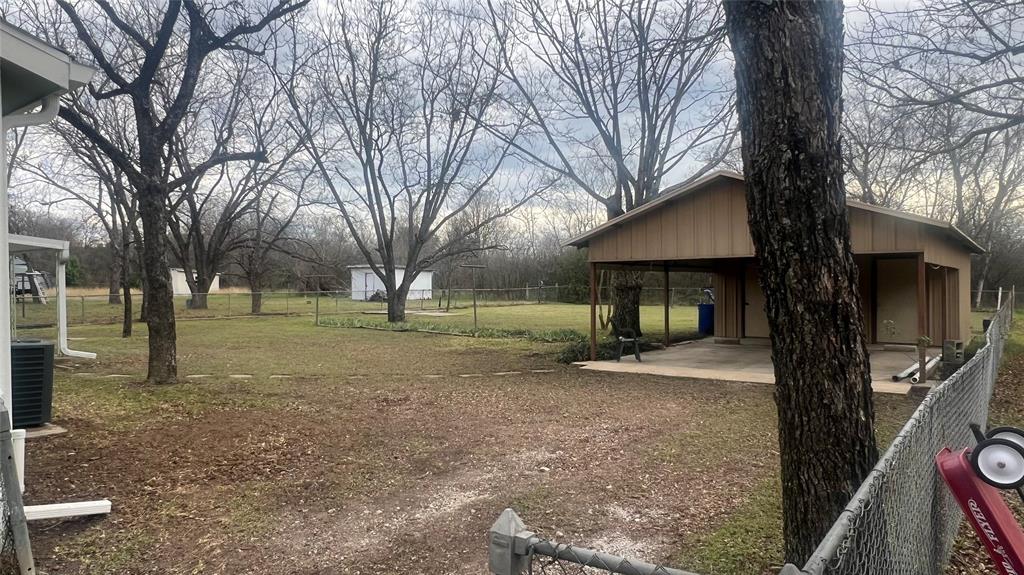 3725 Colina Lane Waco, TX 76705 - Photo 13 of 30 a view of a house with a yard and large tree
