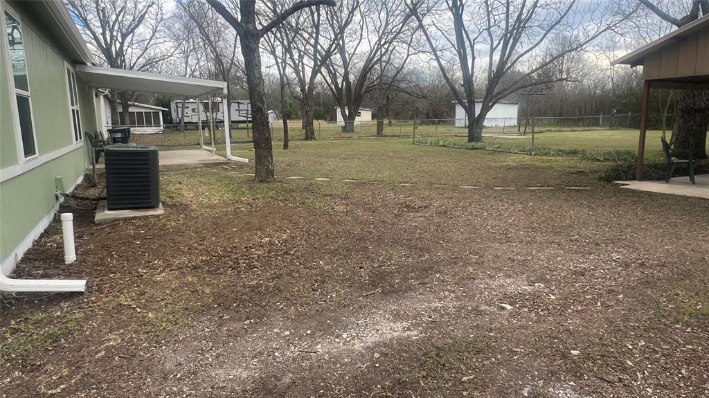 3725 Colina Lane Waco, TX 76705 - Photo 16 of 30 a view of a house with a yard