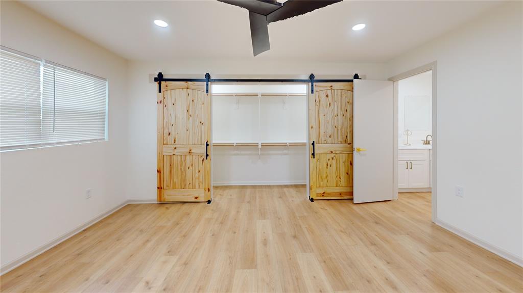 3725 Colina Lane Waco, TX 76705 - Photo 25 of 30 a view of empty room with wooden floor and windows