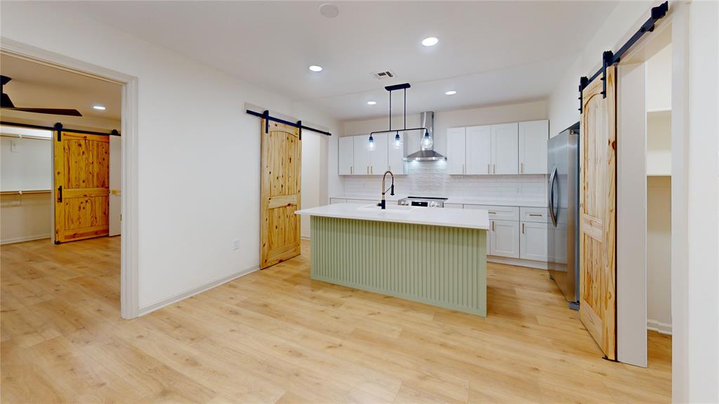 3725 Colina Lane Waco, TX 76705 - Photo 27 of 30 a view of kitchen with kitchen island and stainless steel appliances