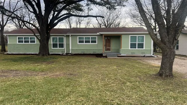 front view of a house with a yard