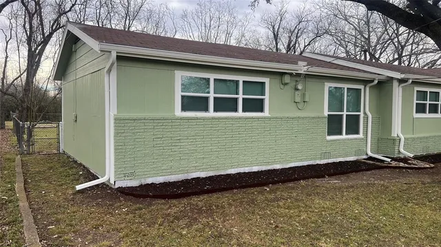 a front view of a house with a garage