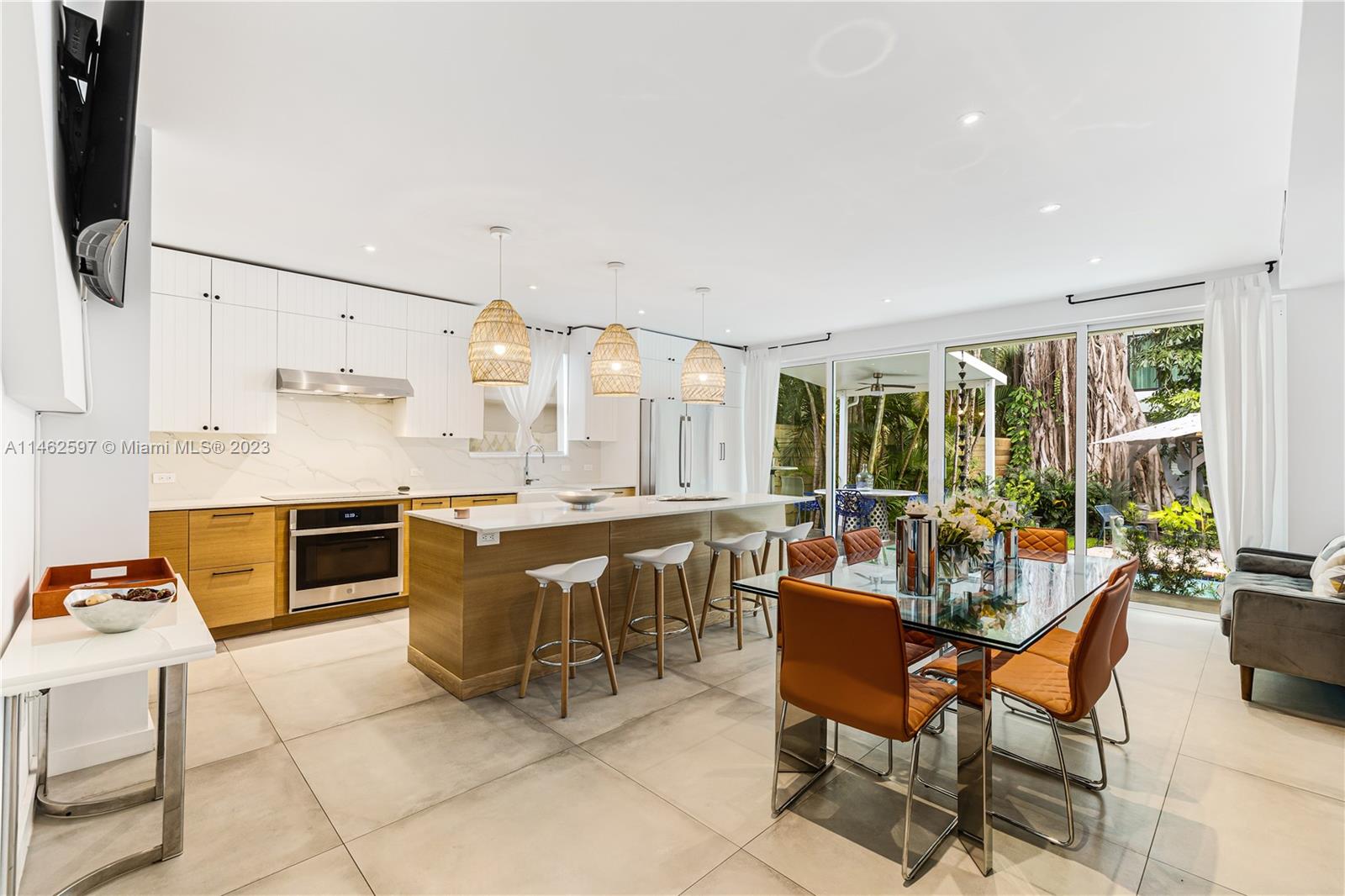 32 Southwest 23rd Road Miami, FL 33129 - Photo 11 of 34 a dining hall with stainless steel appliances a table and chairs