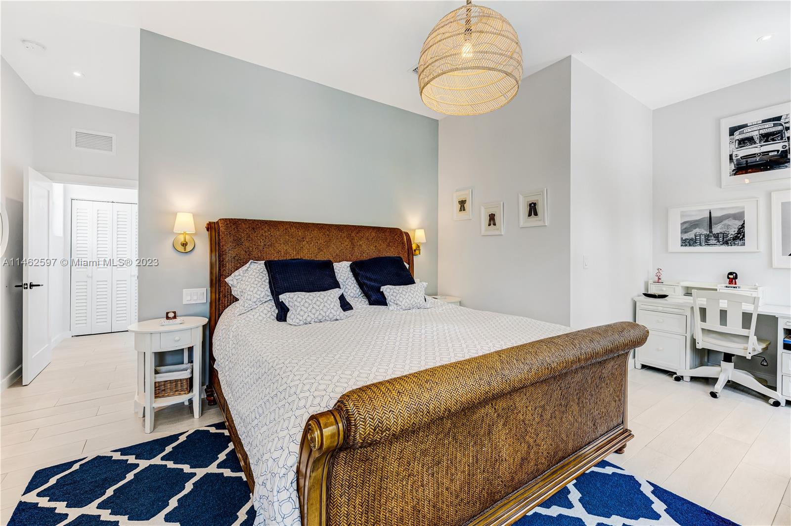 32 Southwest 23rd Road Miami, FL 33129 - Photo 14 of 34 a bedroom with a bed and a chandelier