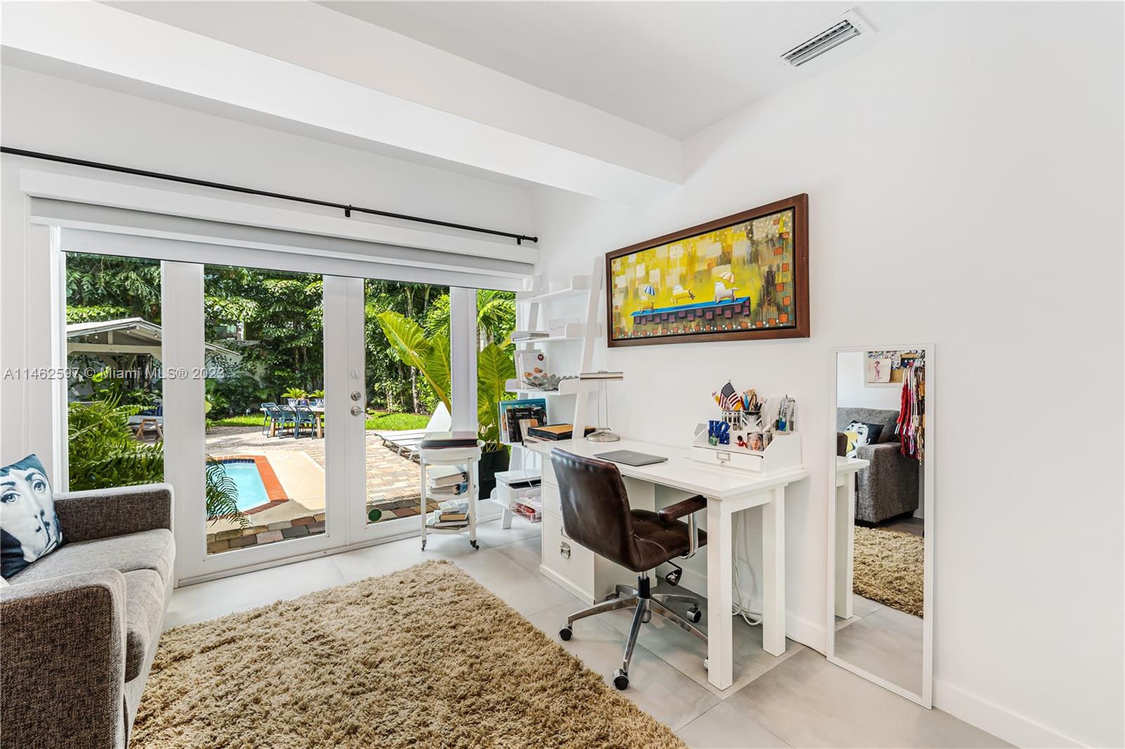 32 Southwest 23rd Road Miami, FL 33129 - Photo 19 of 34 a living room with furniture and a large window
