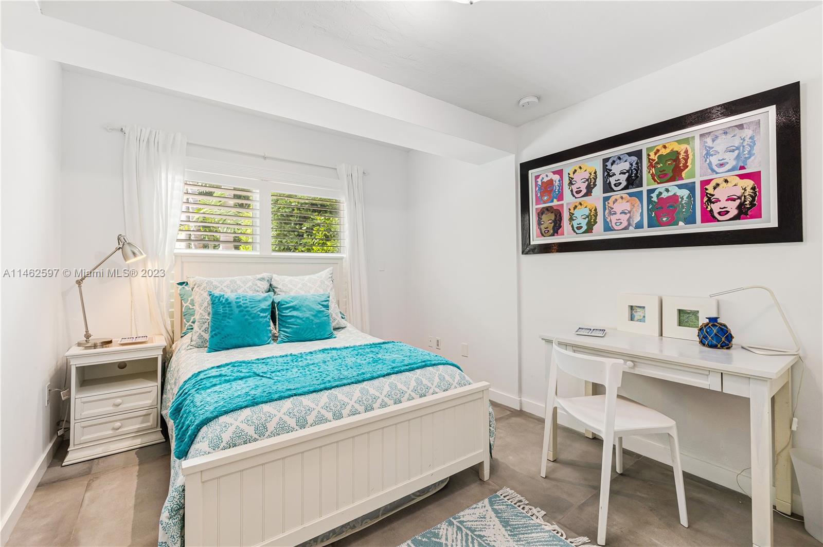 32 Southwest 23rd Road Miami, FL 33129 - Photo 20 of 34 a bedroom with a bed and a desk