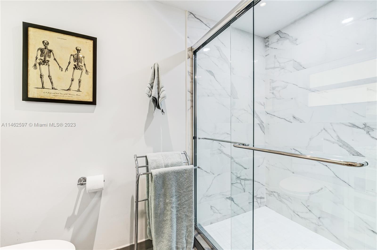 32 Southwest 23rd Road Miami, FL 33129 - Photo 22 of 34 a bathroom with a shower and a toilet