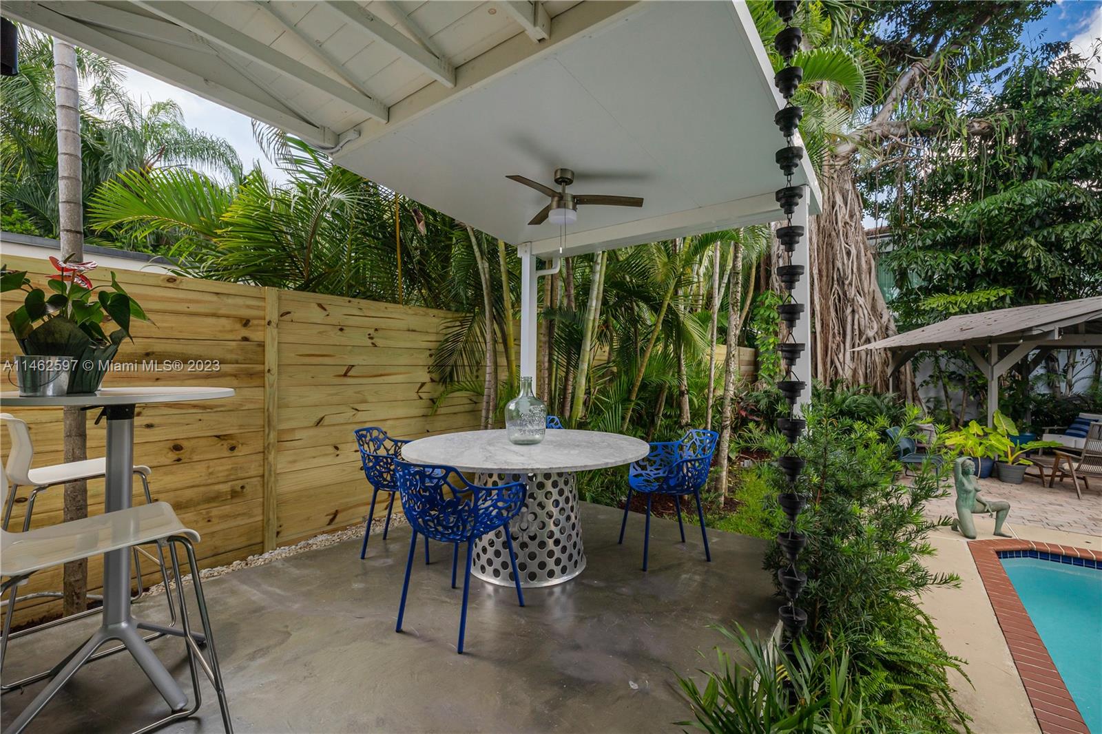 32 Southwest 23rd Road Miami, FL 33129 - Photo 24 of 34 a patio with table and chairs with plants