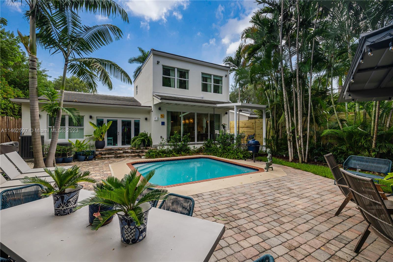 32 Southwest 23rd Road Miami, FL 33129 - Photo 26 of 34 a view of a house with swimming pool and sitting area