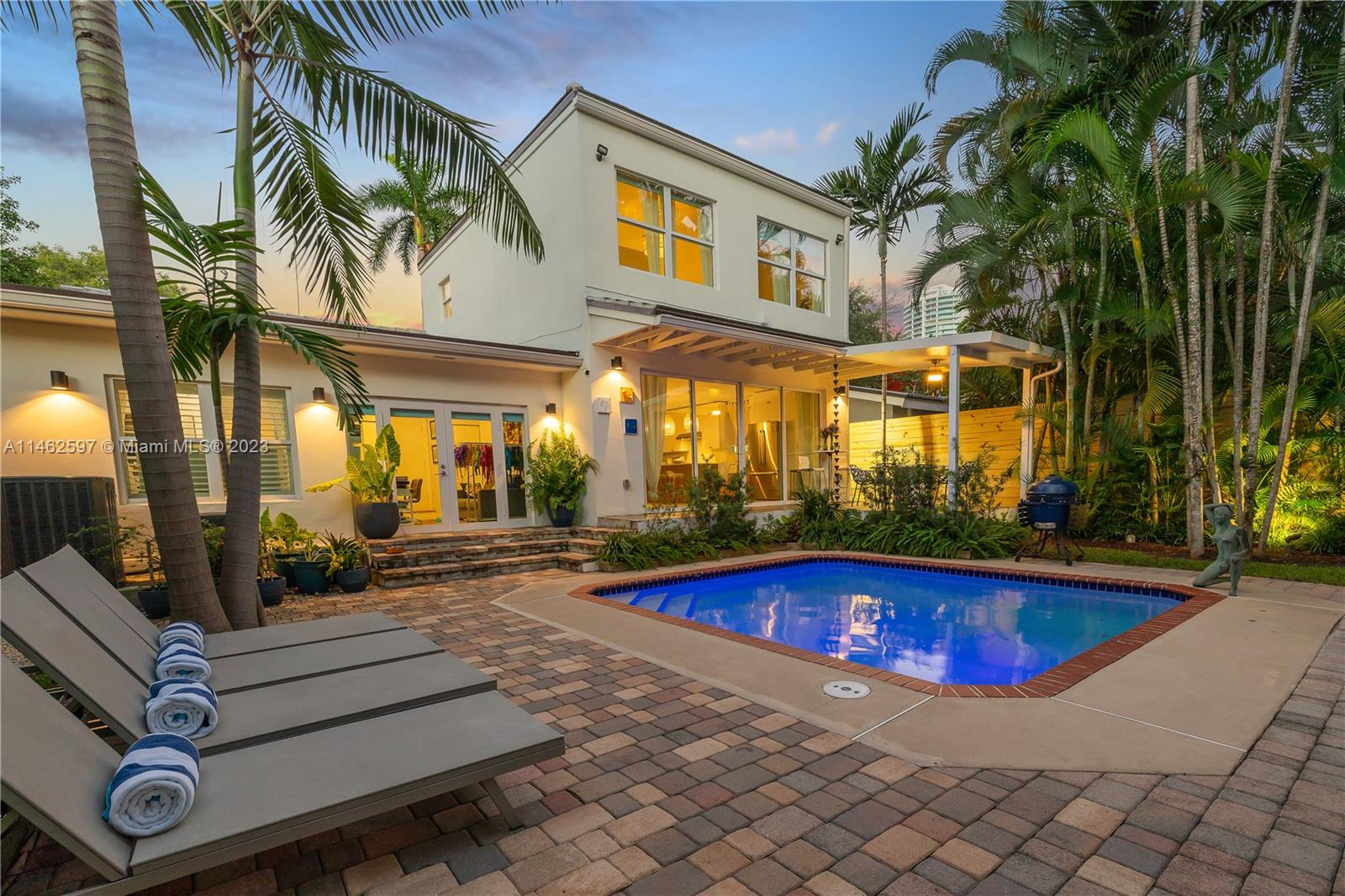32 Southwest 23rd Road Miami, FL 33129 - Photo 29 of 34 a view of pool with lawn chairs and plants