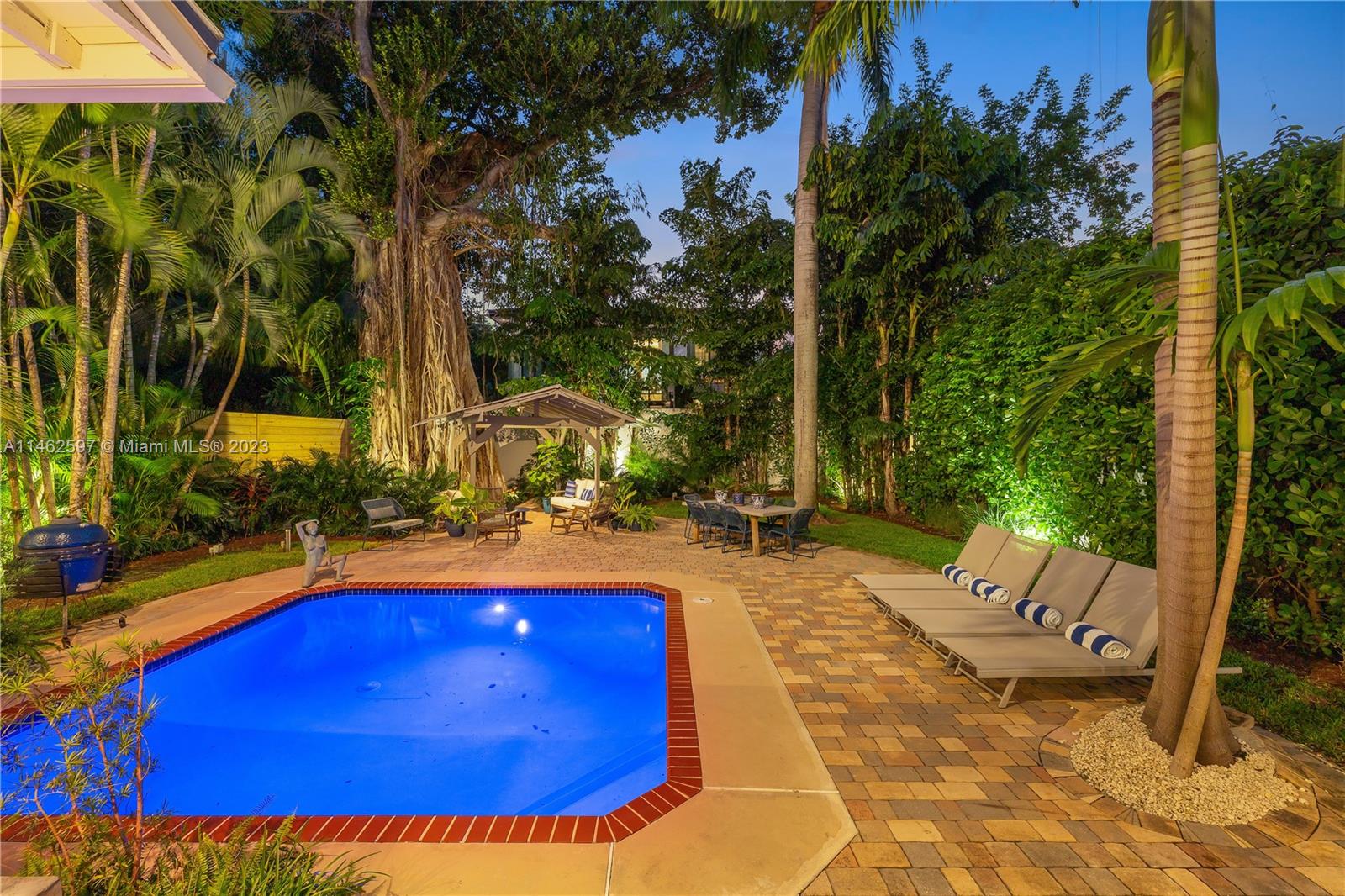32 Southwest 23rd Road Miami, FL 33129 - Photo 30 of 34 a view of swimming pool with a patio and outdoor seating