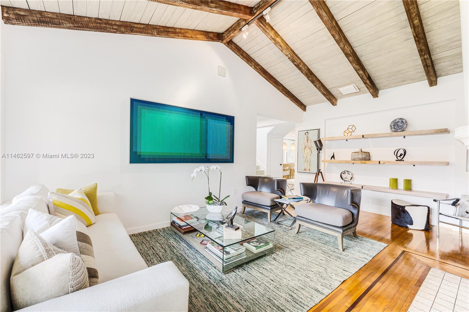 32 Southwest 23rd Road Miami, FL 33129 - Photo 3 of 34 a living room with furniture and a flat screen tv