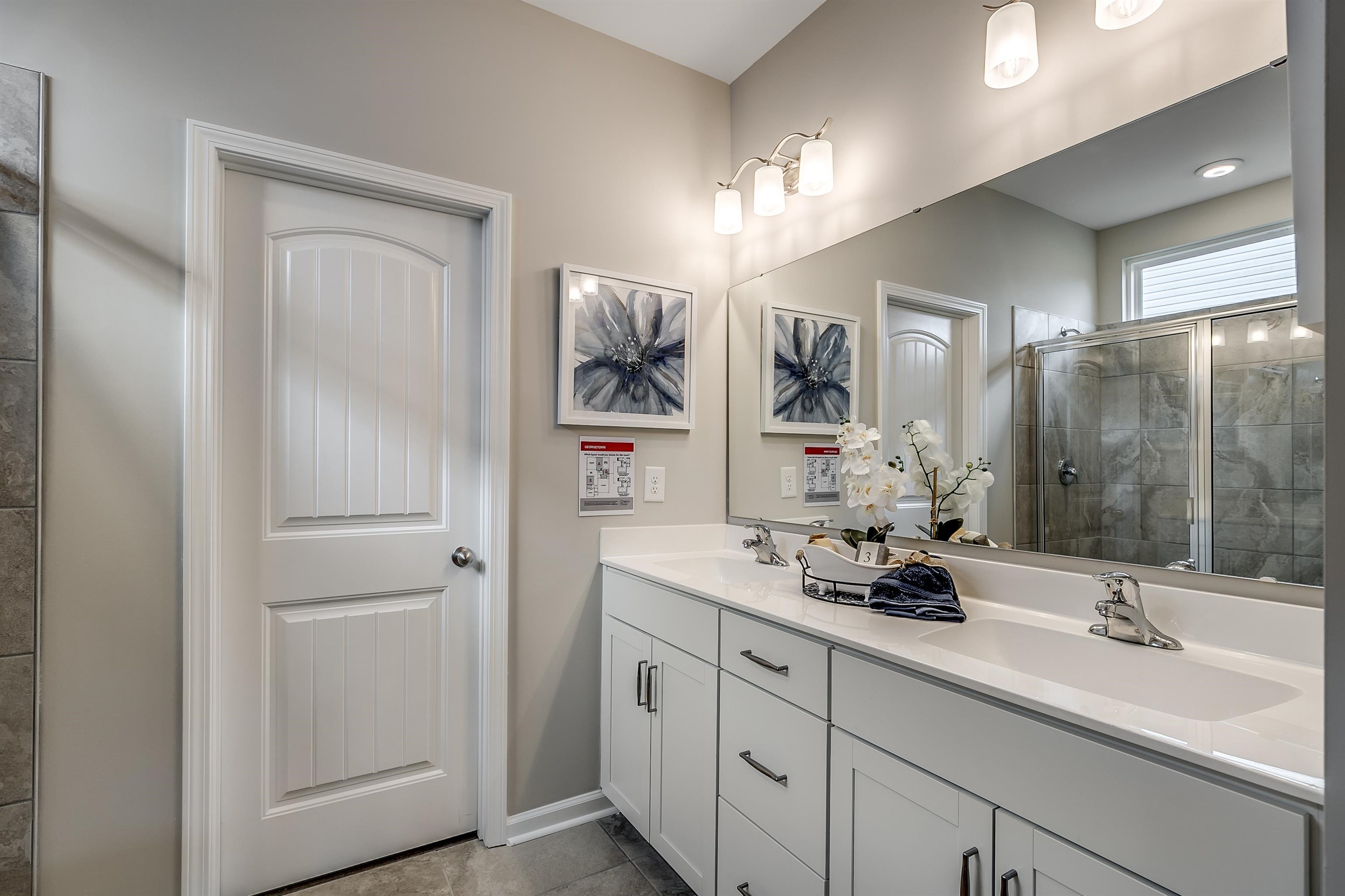 580 Kapalua Loop Little River, SC 29566 - Photo 11 of 24 Full bath featuring a stall shower, double vanity, and light tile patterned floors