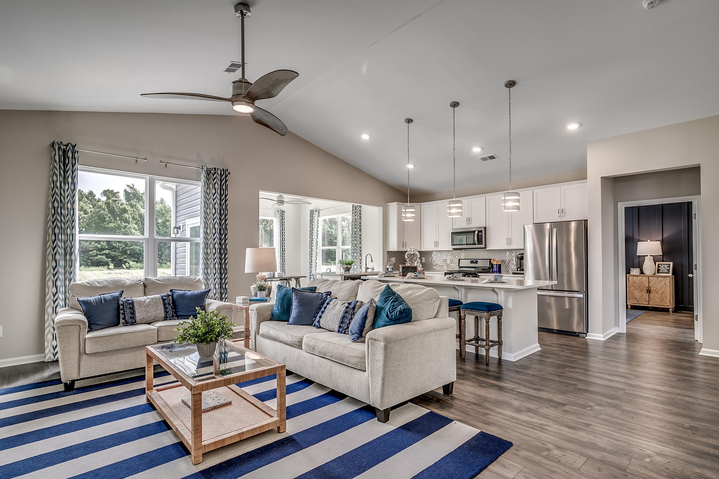 580 Kapalua Loop Little River, SC 29566 - Photo 5 of 24 Living area featuring dark wood-style floors, ceiling fan, vaulted ceiling, and recessed lighting