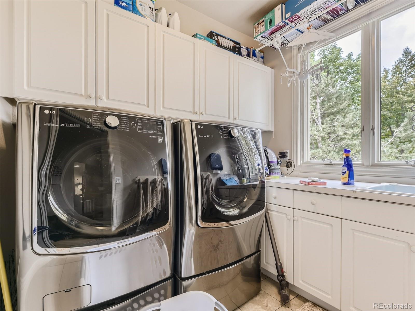992 West Ridge Road Littleton, CO 80120 - Photo 34 of 44 a utility room with dryer and washer