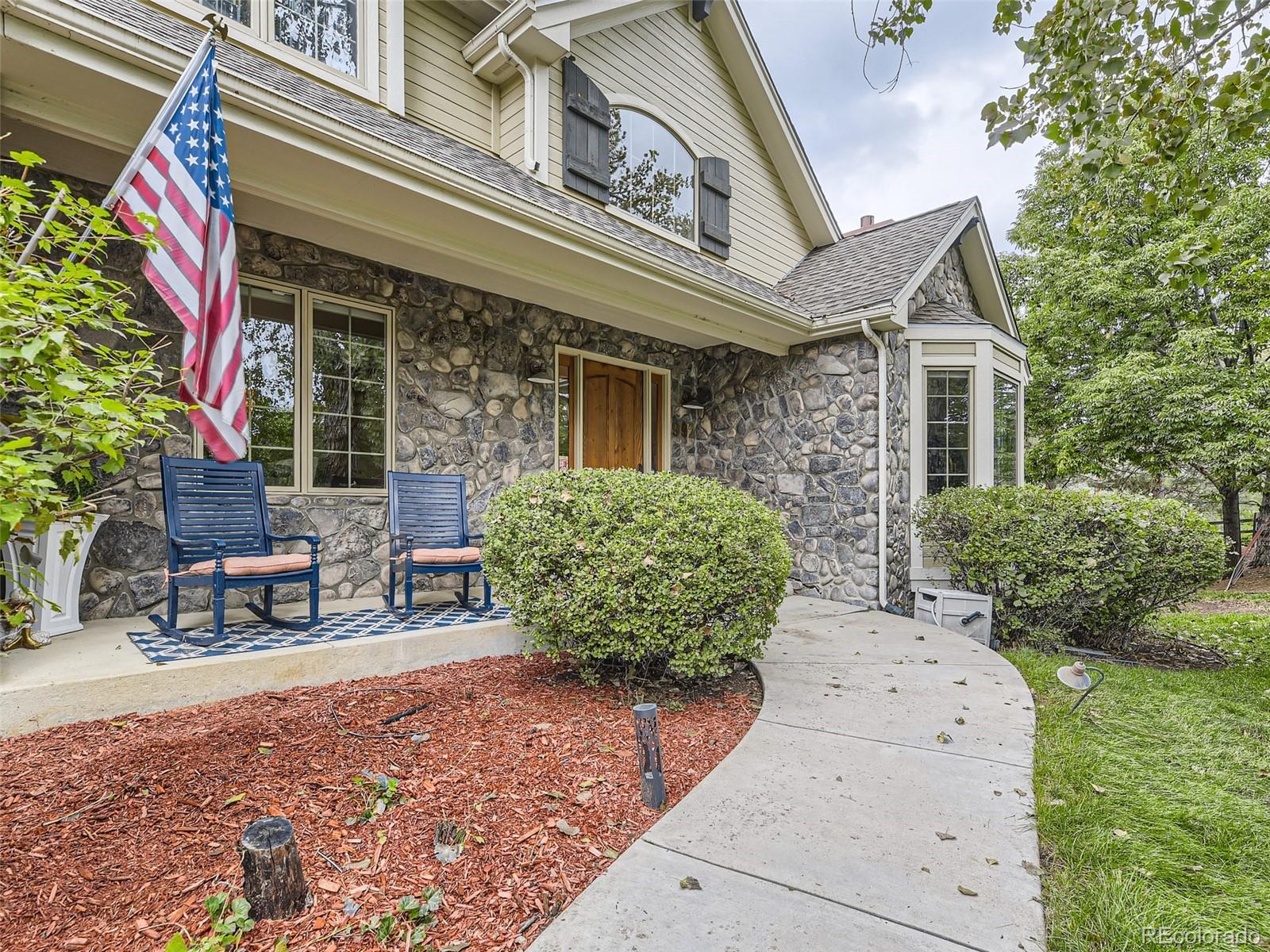 992 West Ridge Road Littleton, CO 80120 - Photo 39 of 44 a view of a patio with table and chairs and potted plants