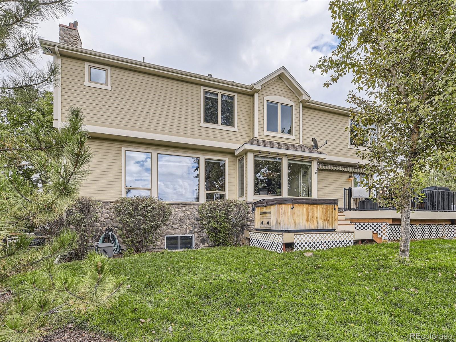 992 West Ridge Road Littleton, CO 80120 - Photo 40 of 44 a front view of a house with a yard