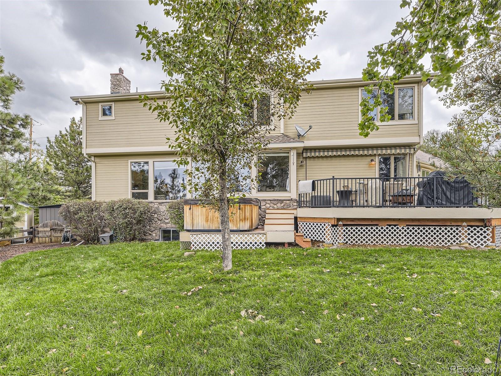 992 West Ridge Road Littleton, CO 80120 - Photo 41 of 44 front view of a house with a yard