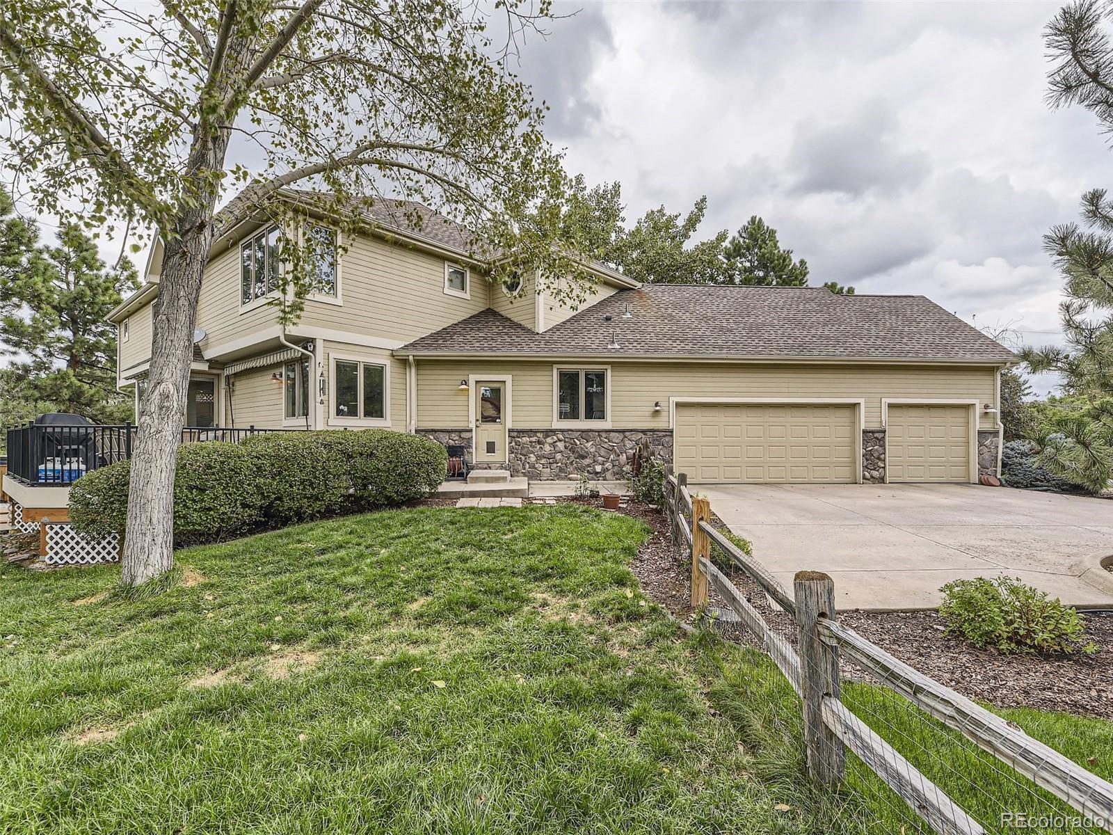 992 West Ridge Road Littleton, CO 80120 - Photo 42 of 44 a front view of a house with garden