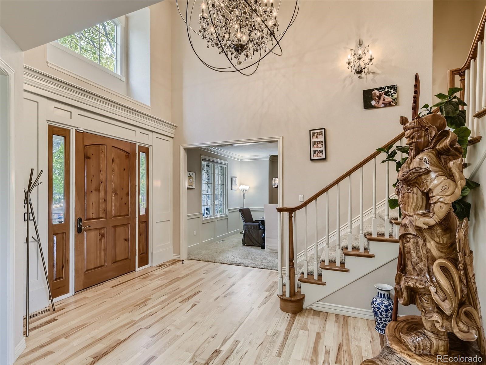 992 West Ridge Road Littleton, CO 80120 - Photo 5 of 44 a view of entryway with wooden floor