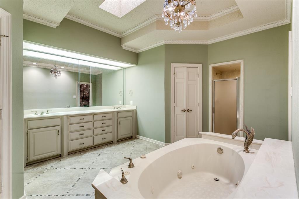 1920 Pearson Crossing Keller, TX 76248 - Photo 19 of 25 a bathroom with a tub sink and mirror
